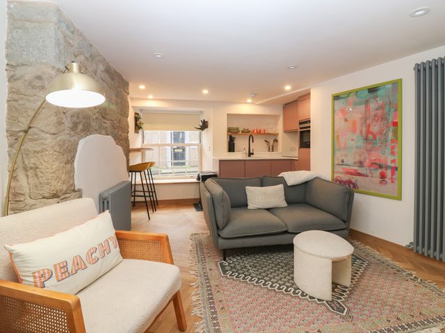 A living room with furniture and decor at 2 East Port Melrose