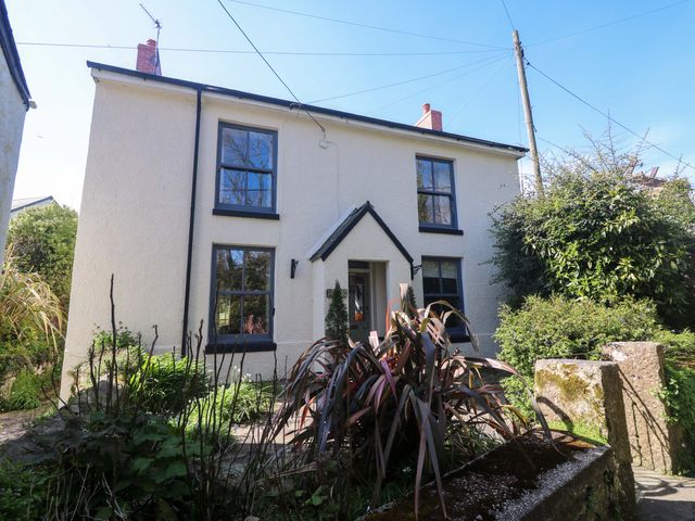 A house with plants and windows at Pedn Brose near Mousehole
