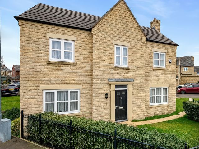 An exterior view of a house with windows and garden at The Winster in Marple, Stockport