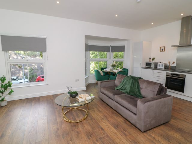 A living room with a sofa and coffee table at 3 in Peterborough