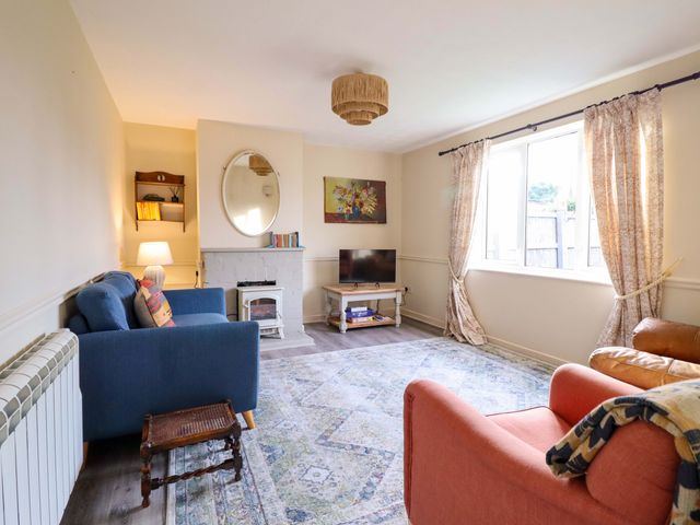A living room with sofas and a television at 2 Horseshoe Road Montgomery