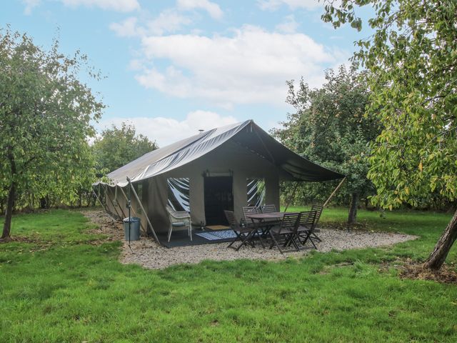 A tent with a table and chairs set outside at Hedgerow in Bewdley