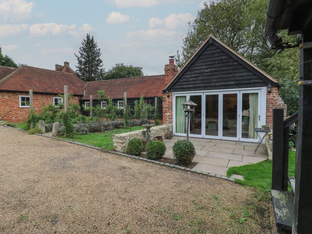 A house with a garden and patio area at The Piggery in Maidstone