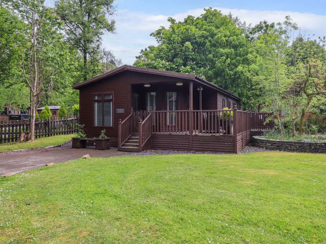A cabin with deck and garden at Costapacket, Grasmere 12, White Cross Bay near Windermere
