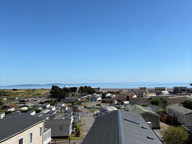 A view of caravans and the sea at Pendine Sands - Holiday Accommodation 12302 in Carmarthen