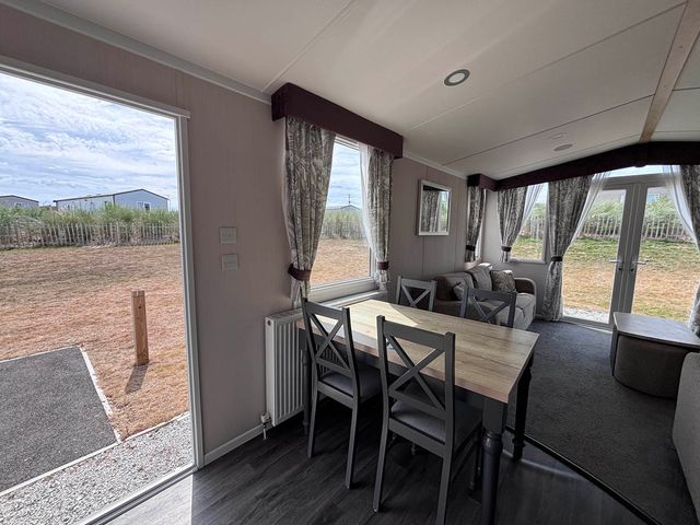 A dining room with a table and chairs at Perran Sands - Holiday Accommodation 614 Perranporth