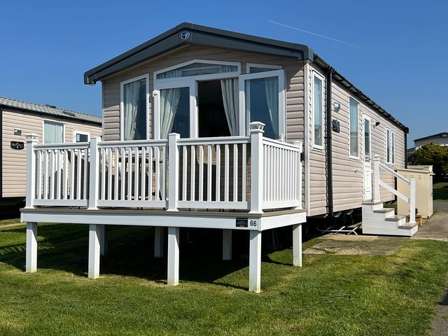 A caravan with a deck at Littlesea Holiday Park - Holiday Accommodation 15976 in Weymouth