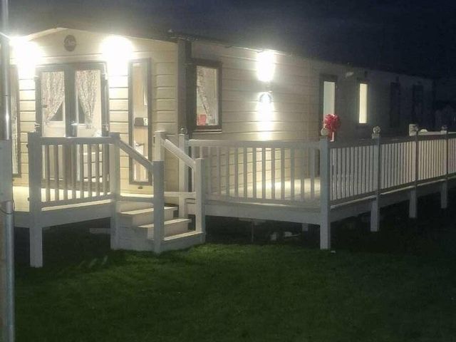 a holiday home exterior with a deck at Marine Holiday Park - Holiday Accommodation 16604 in Rhyl
