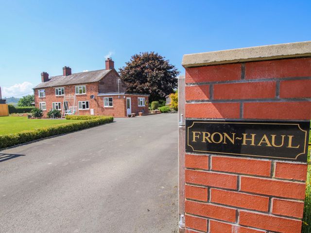 A house with a driveway and gate at Fron-Haul near Llansantffraidd-Ym-Mechain