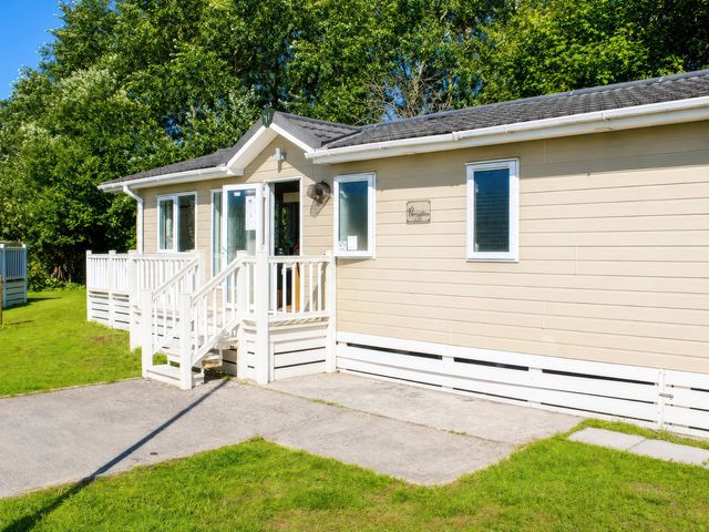 A house with steps and grass at Trecco Bay - Holiday Accommodation 18463, Porthcawl