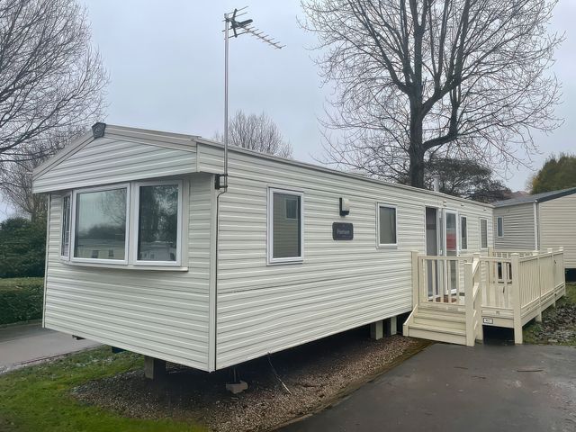 A caravan with steps and windows at Marton Mere Holiday Village - Holiday Accommodation 18865 Blackpool