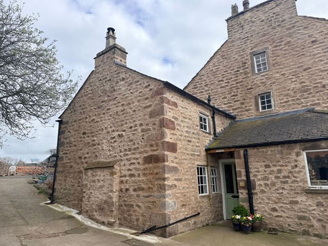 An exterior view of a building with windows and a door at The Snug in Overton near Heysham