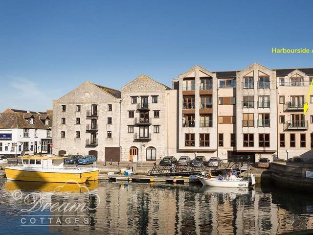 A building with apartments and boats at Harbourside Apartment Weymouth