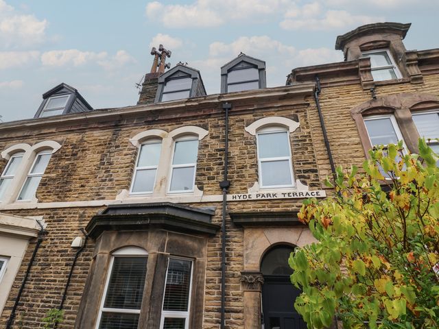 A building with windows and a sign at Flat 2 23 Hyde Park Road in Harrogate