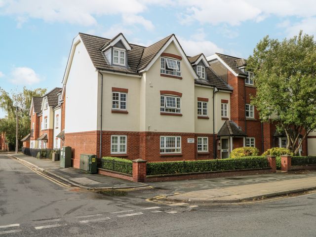 A building with multiple apartments at 24 Wilmslow Court Wilmslow