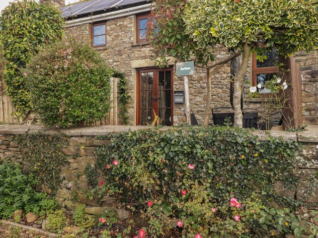 A front door and garden area at Arian in Aberdare