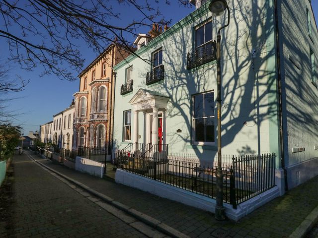 A row of houses with a streetlight and shadows at 8 Corkickle Whitehaven