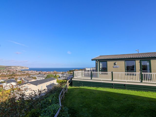 A view of the sea and surroundings from a mobile home at 91 Swanage Coastal Park in Swanage