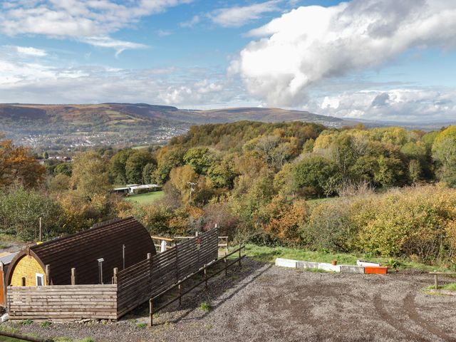 A view of hills and trees with a cabin at Cwtch Bach Aberdare