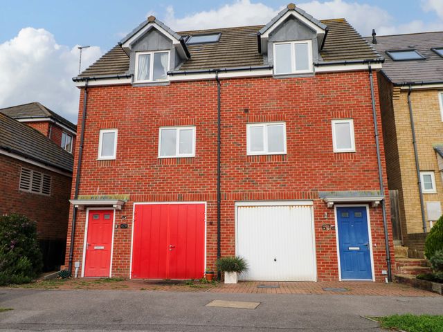 A house with a red and blue door at 67a Harbour Way Shoreham-by-Sea