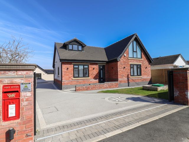 A house with a post box and driveway at 1 Talbot Drive Talacre