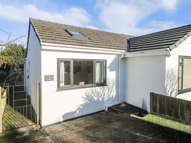 A house exterior with a garden gate at Blake Lodge in Crantock