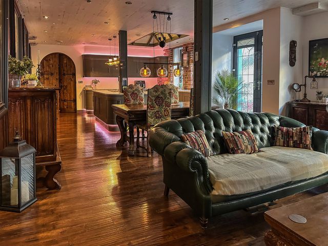 A living room with a sofa and wooden table at The Old Barn in Manchester