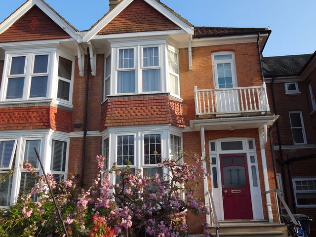 A house with a balcony and front door at 55 Egerton Road