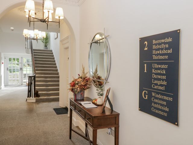A hallway with a table and a signboard at Derwent in Ulverston