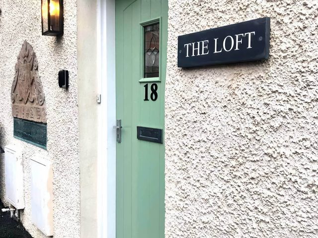 A door with number 18 and a nameplate 'The Loft' at the property