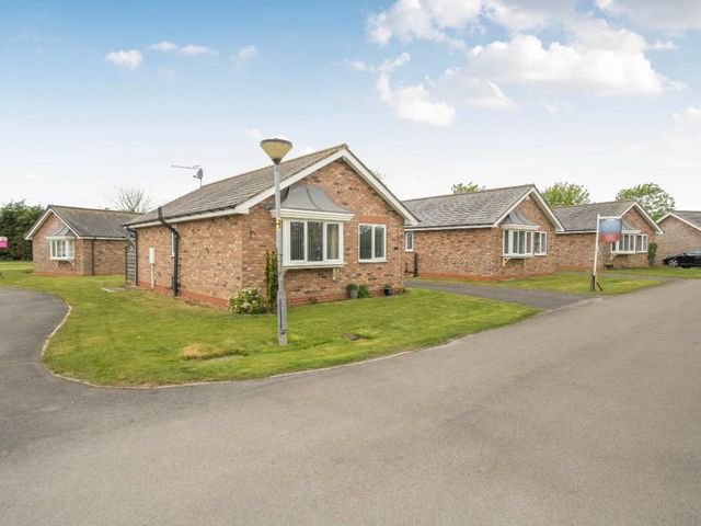 A residential area with several houses along a driveway at Ivy Corner in Bridlington