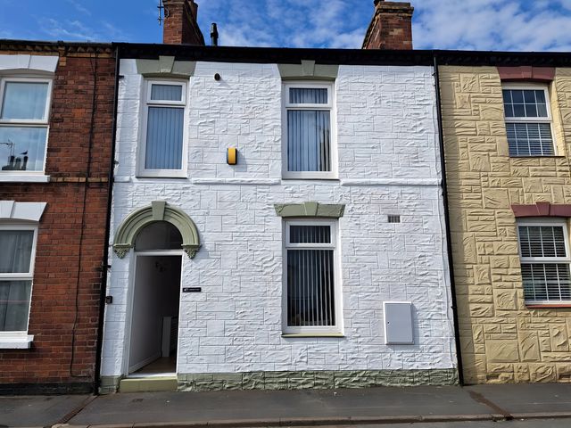 A house facade with entrance and windows at Fisherman's Cottage in 