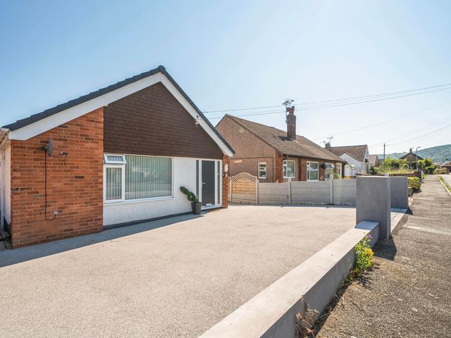 A house with a driveway and fence at 58 Clifton Rise Abergele