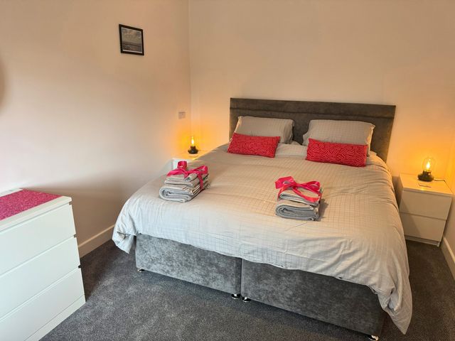 A bedroom with a bed and towels on it at Withi-Gill