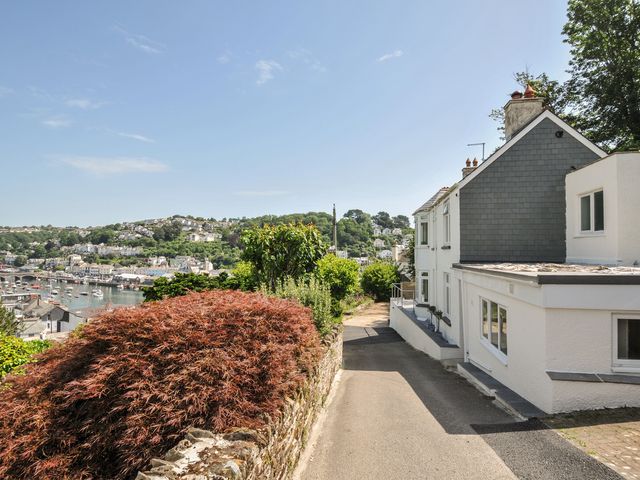 A view of a house with a pathway and garden in Looe