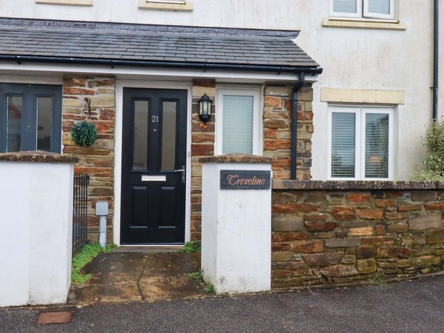 The entrance of a house with a black front door at 21 Greenwix Parc