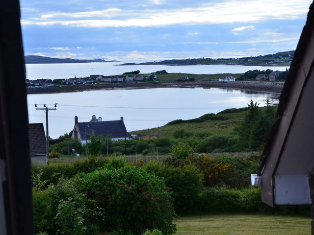 A view of houses and water from the garden at Oran Na Mara in Achnasheen