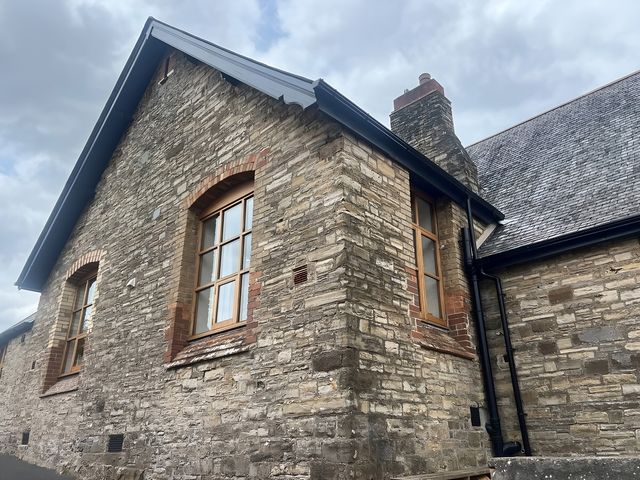 An exterior view of a stone building with windows at 4 Bickington Road Barnstaple