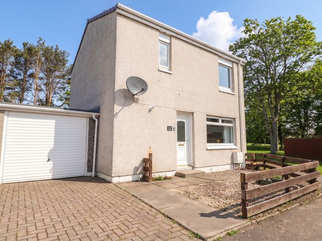 A house with a garage and a satellite dish at Taigh Ban in Nairn
