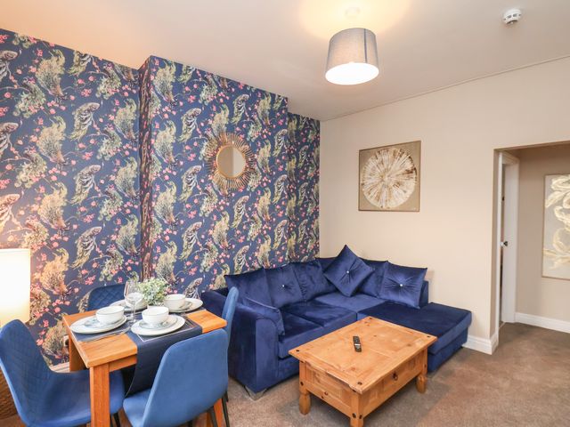 A living room with a sofa and coffee table at Apartment 2, Blackburn Heights in Bridlington