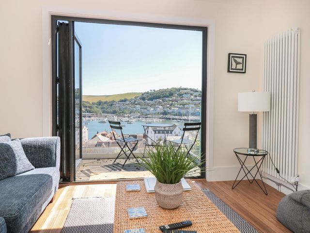 A living room with a view of the harbor at Ty'r Ddraig in Dartmouth