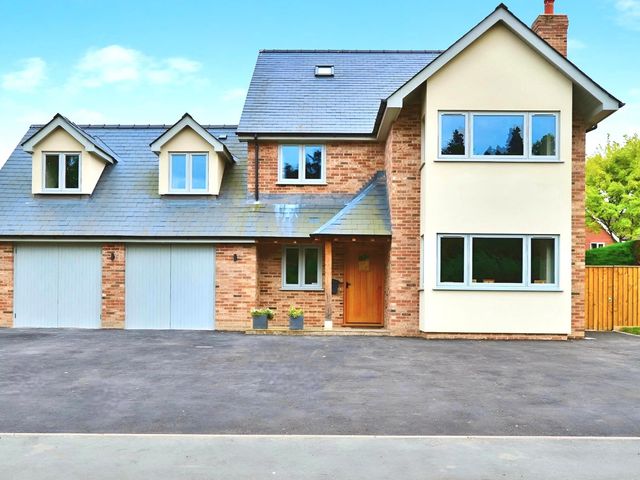 A house with garage and multiple windows at Cefn Coed in Presteigne