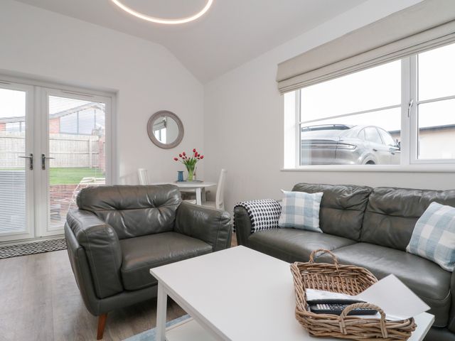 A living room with a sofa and coffee table at The Nest in 