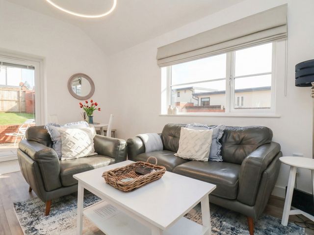 A living room with a sofa and coffee table at The Nest in Buckton near Bridlington