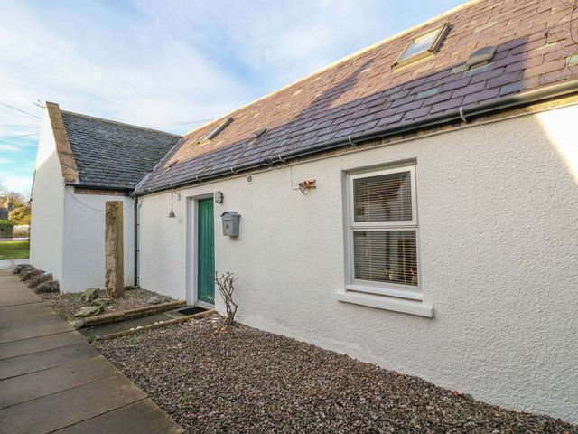 A house entrance with a door and window at 78 Findhorn in Forres