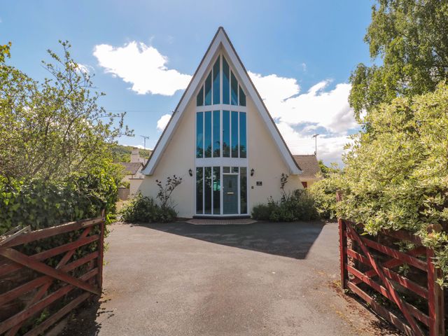 A house with large windows and a driveway at Lady Of Lourdes in Whitchurch, Herefordshire