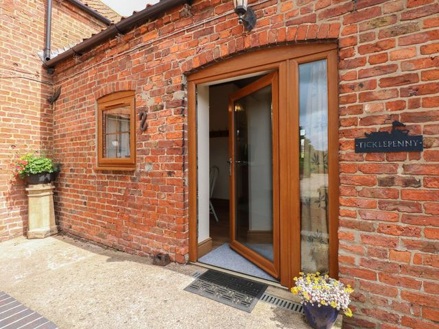 An entrance with brick wall and front door at Ticklepenny in Louth