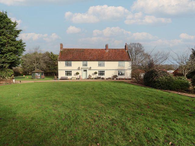 A house with a garden and trees at Farmhouse in Beccles