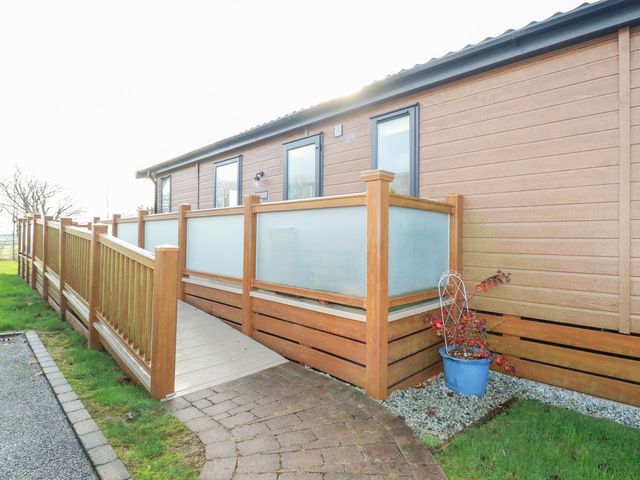 An outdoor area featuring a wooden fence and decking at FW4 (Fairways 4)