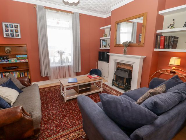 A living room with a coffee table and sofa at 18 Kent Street, Cardiff